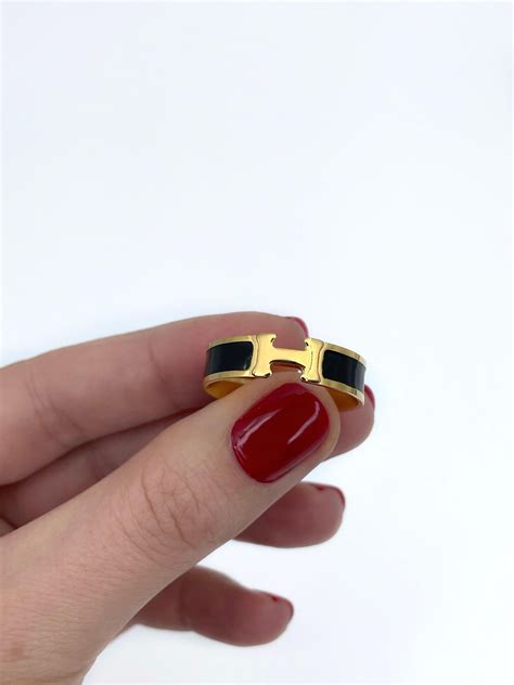 Vintage Hermès 18 Karat Yellow Gold Black Enamel Clic H Ring.